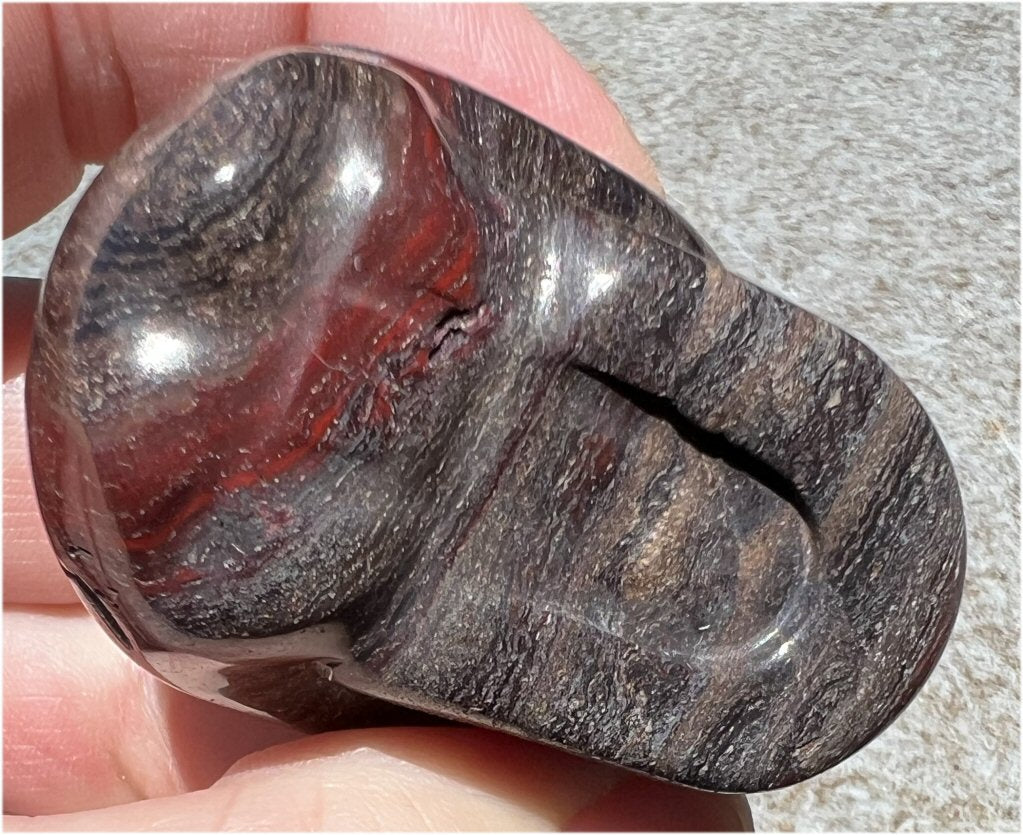 Red Spiral Jasper Crystal Skull with LOTS of Hematite