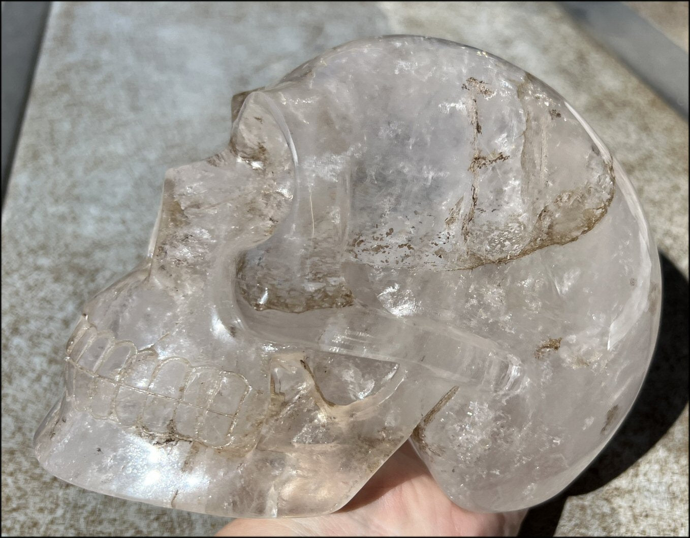 LifeSize Himalayan Quartz Crystal Skull with Chlorite, Hematite, Manganese streaking + Shimmery Rainbows