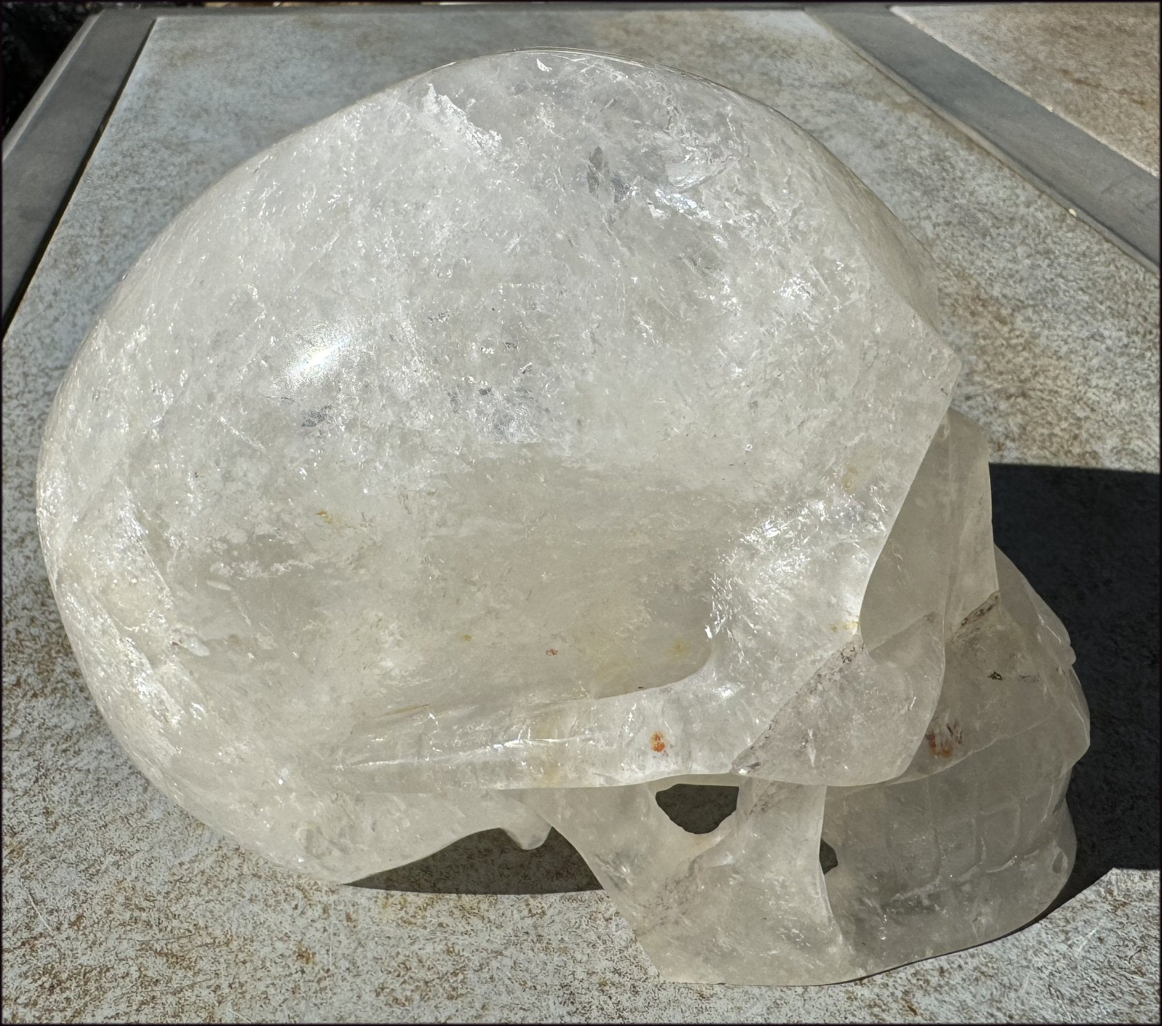 LifeSize Himalayan Quartz Crystal Skull with Crown Chakra Rainbows, Multi-Colored Hematite