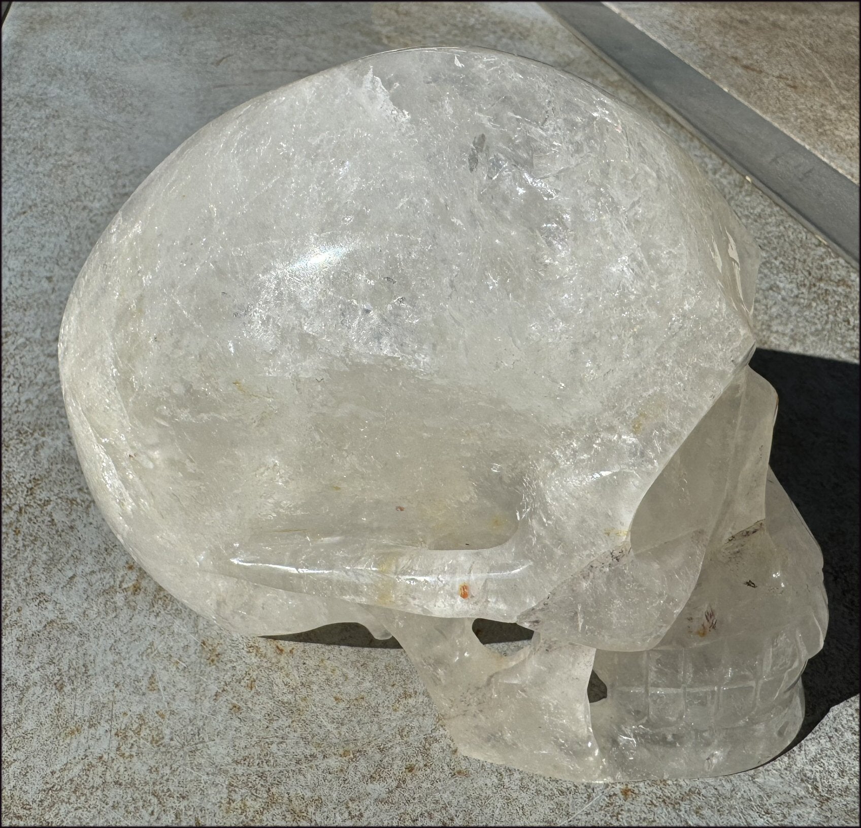 LifeSize Himalayan Quartz Crystal Skull with Crown Chakra Rainbows, Multi-Colored Hematite