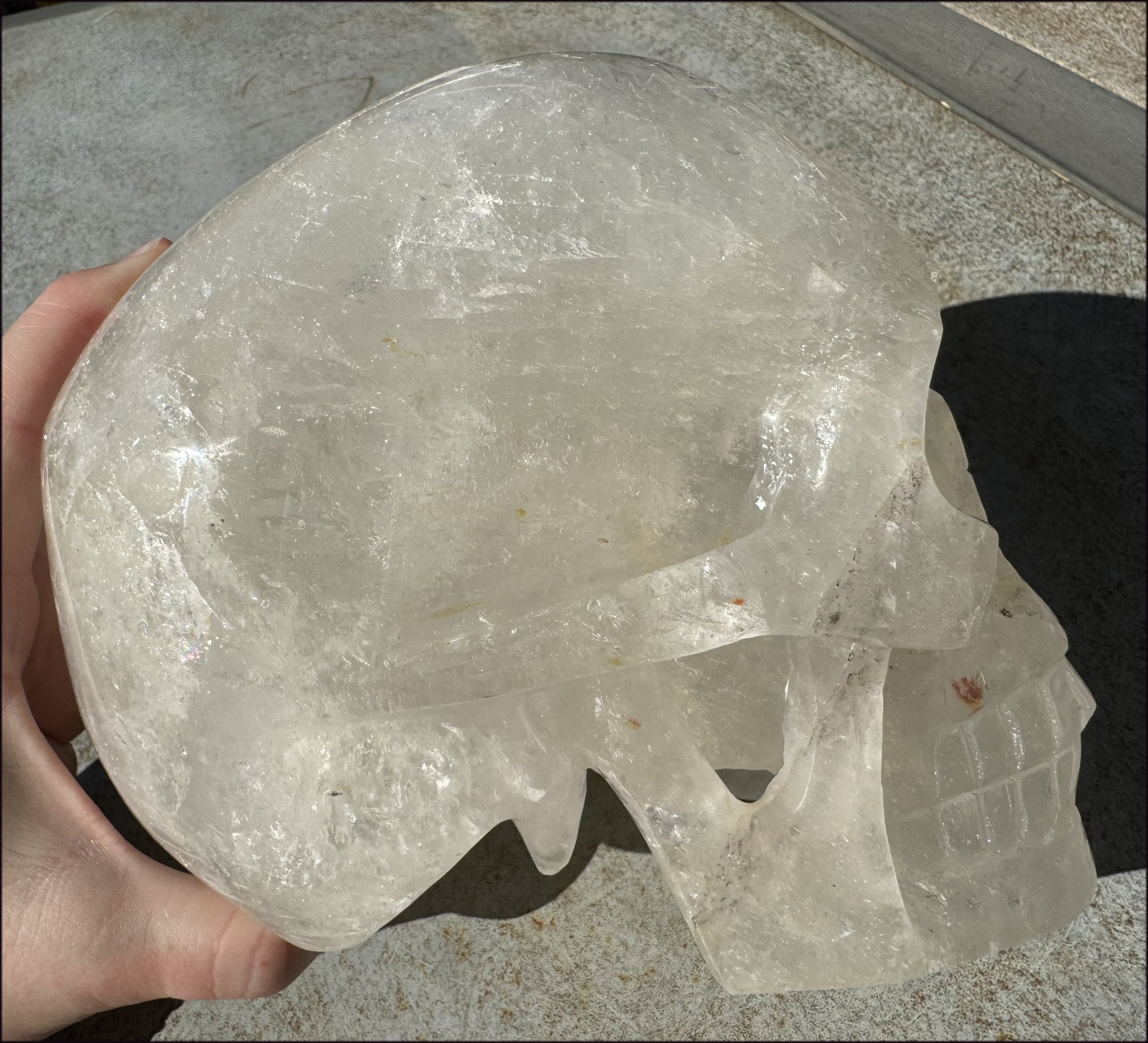 LifeSize Himalayan Quartz Crystal Skull with Crown Chakra Rainbows, Multi-Colored Hematite