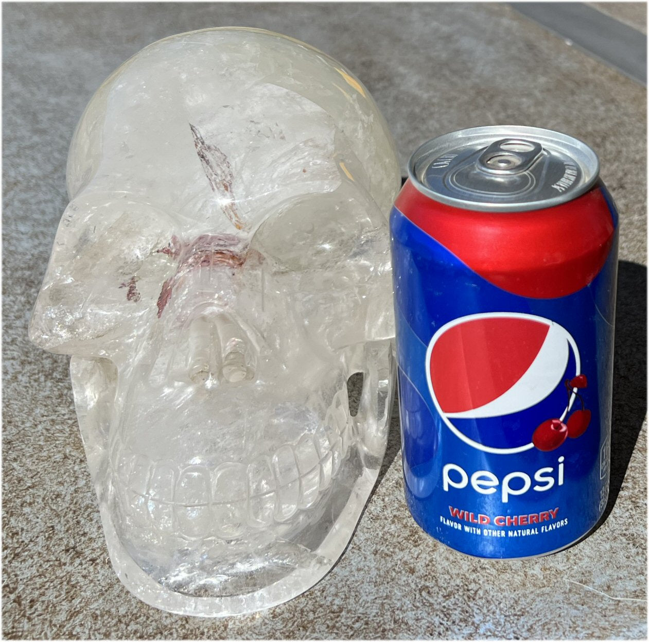 LifeSize Himalayan Quartz Crystal Skull with Multi-Colored Hematite, Lovely Rainbows